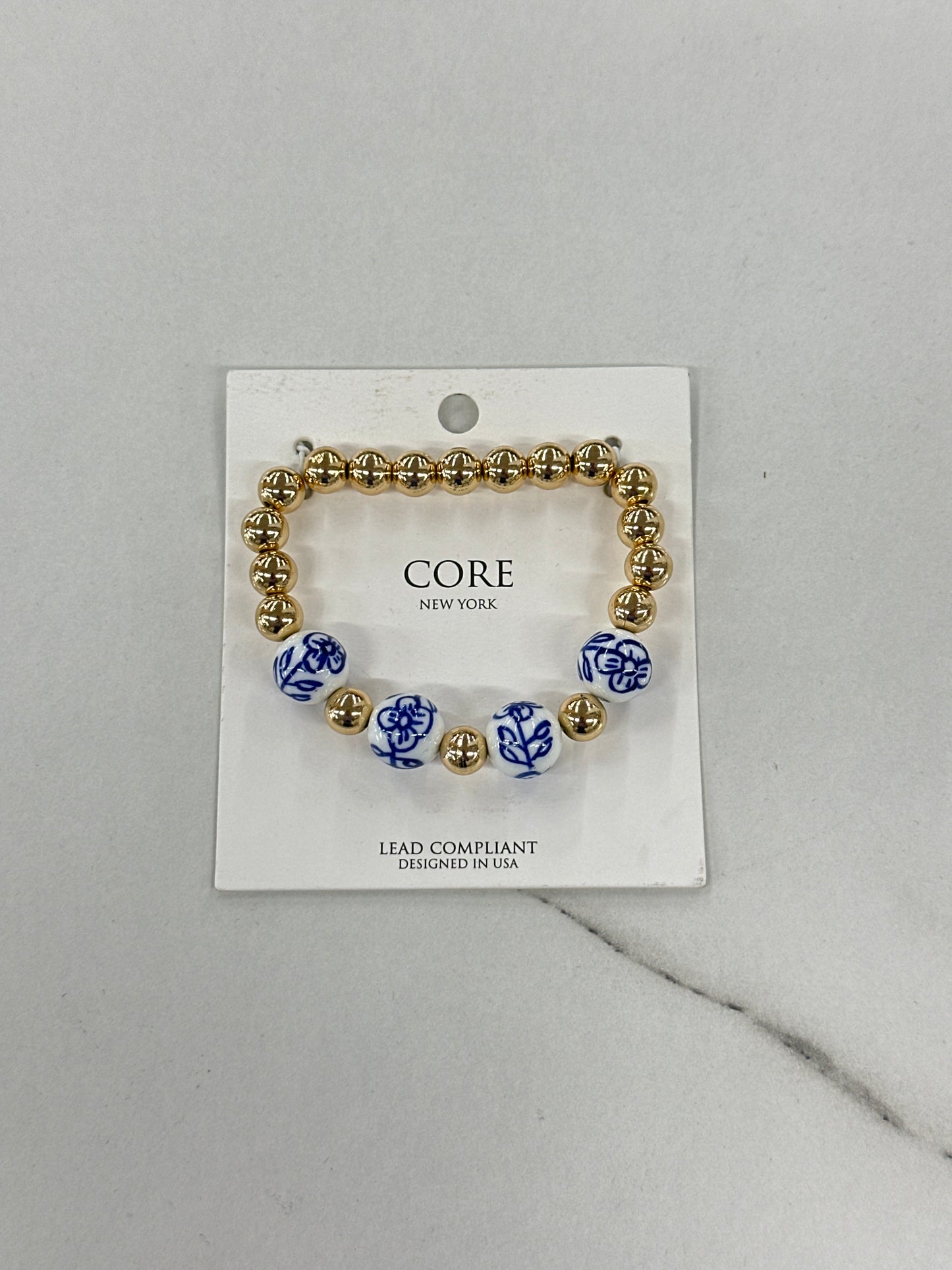 Gold Bracelet with Blue & White Floral Beads