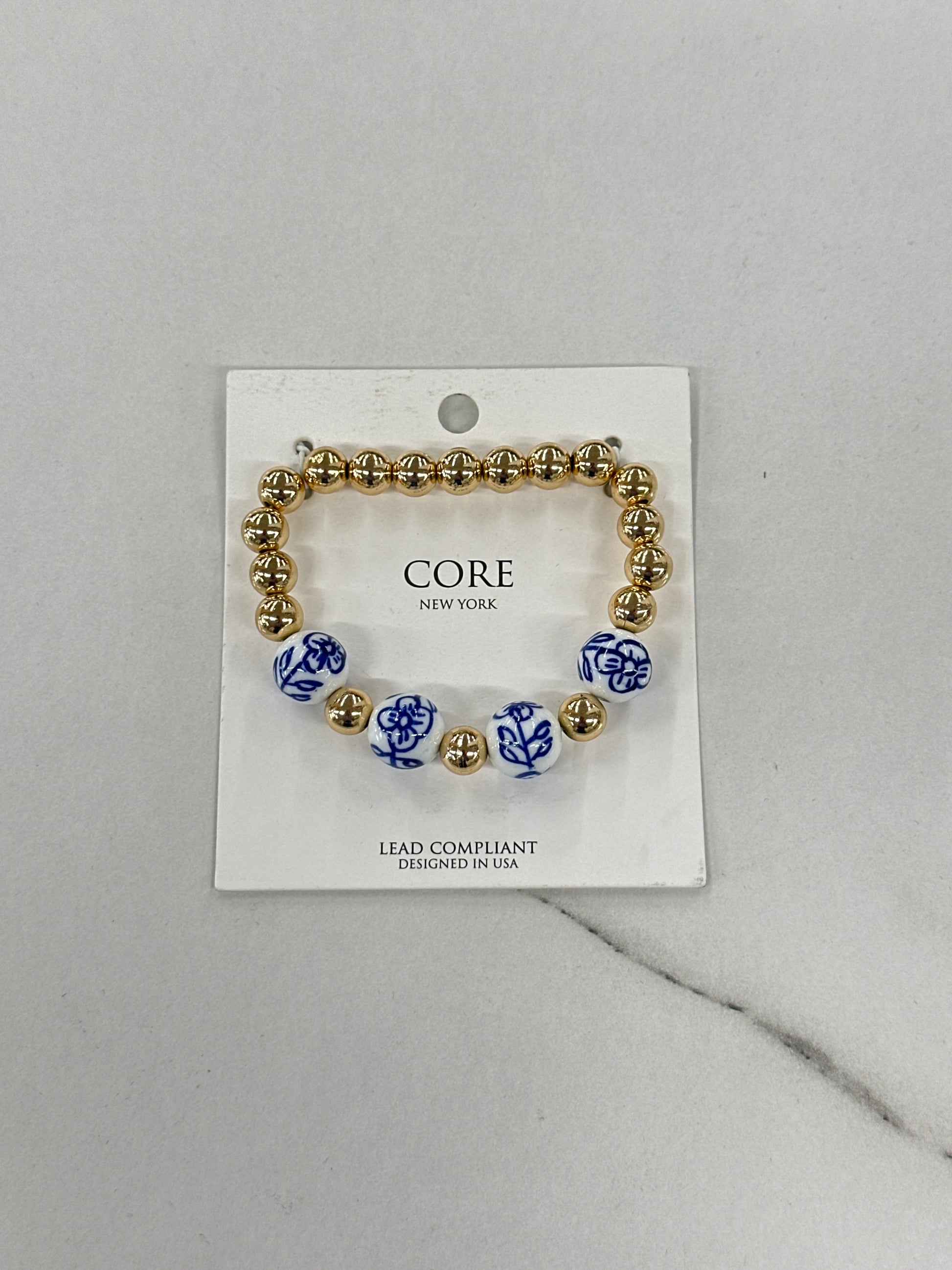 Gold Bracelet with Blue & White Floral Beads
