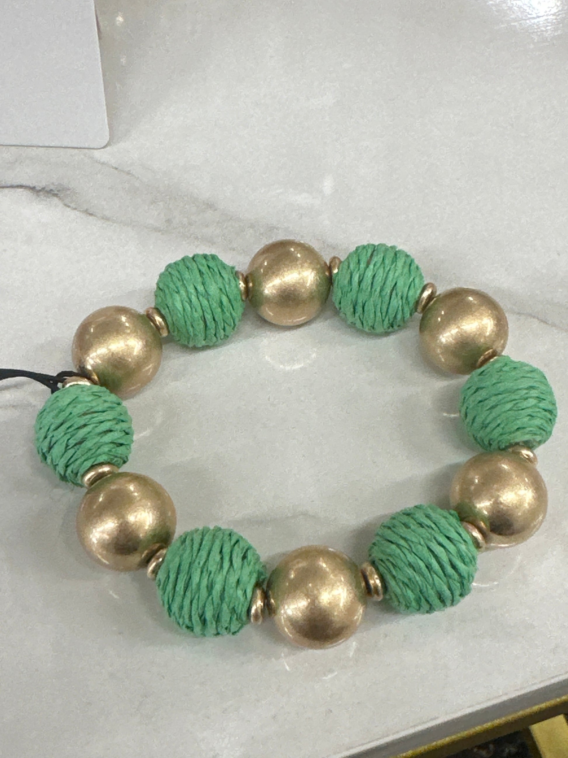Canvas Style Demi Green Raffia And Gold Ball Bead Bracelet