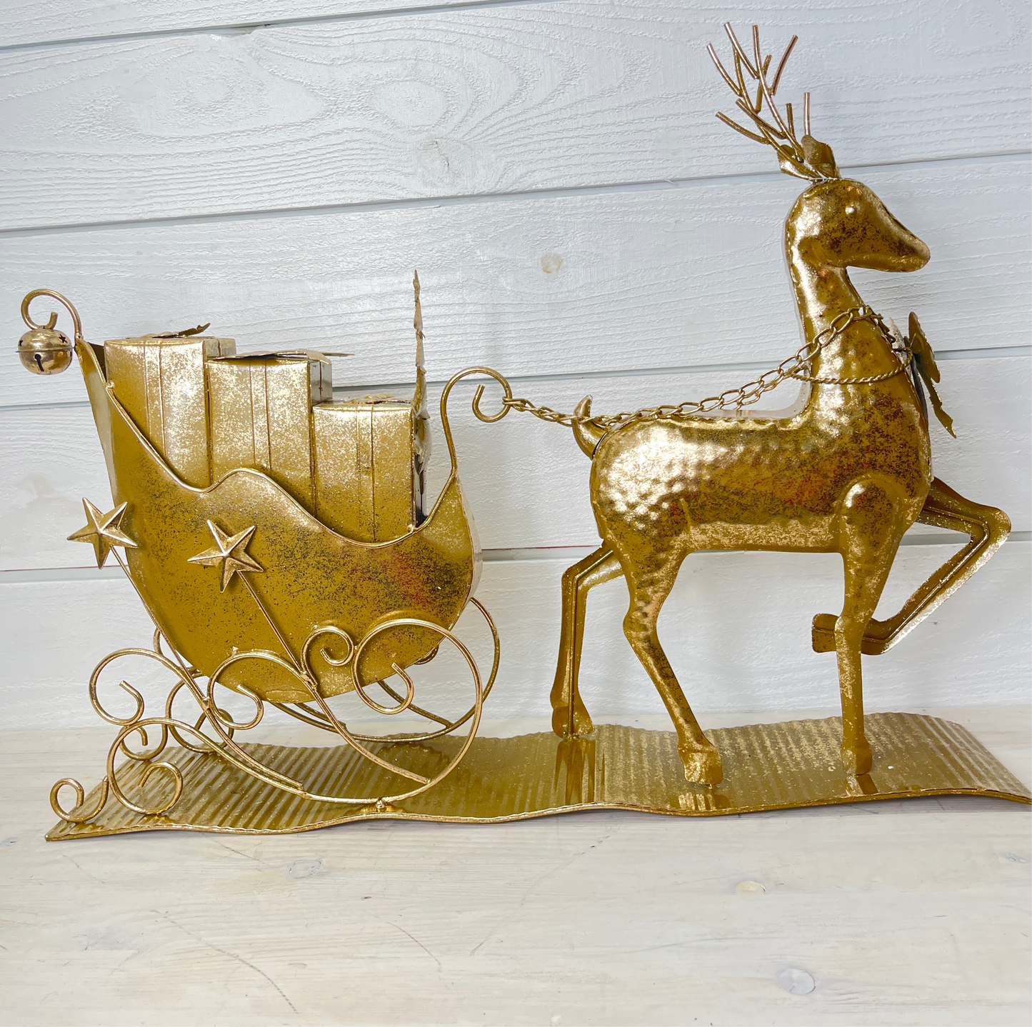 Gold Reindeer Pulling Christmas Sled