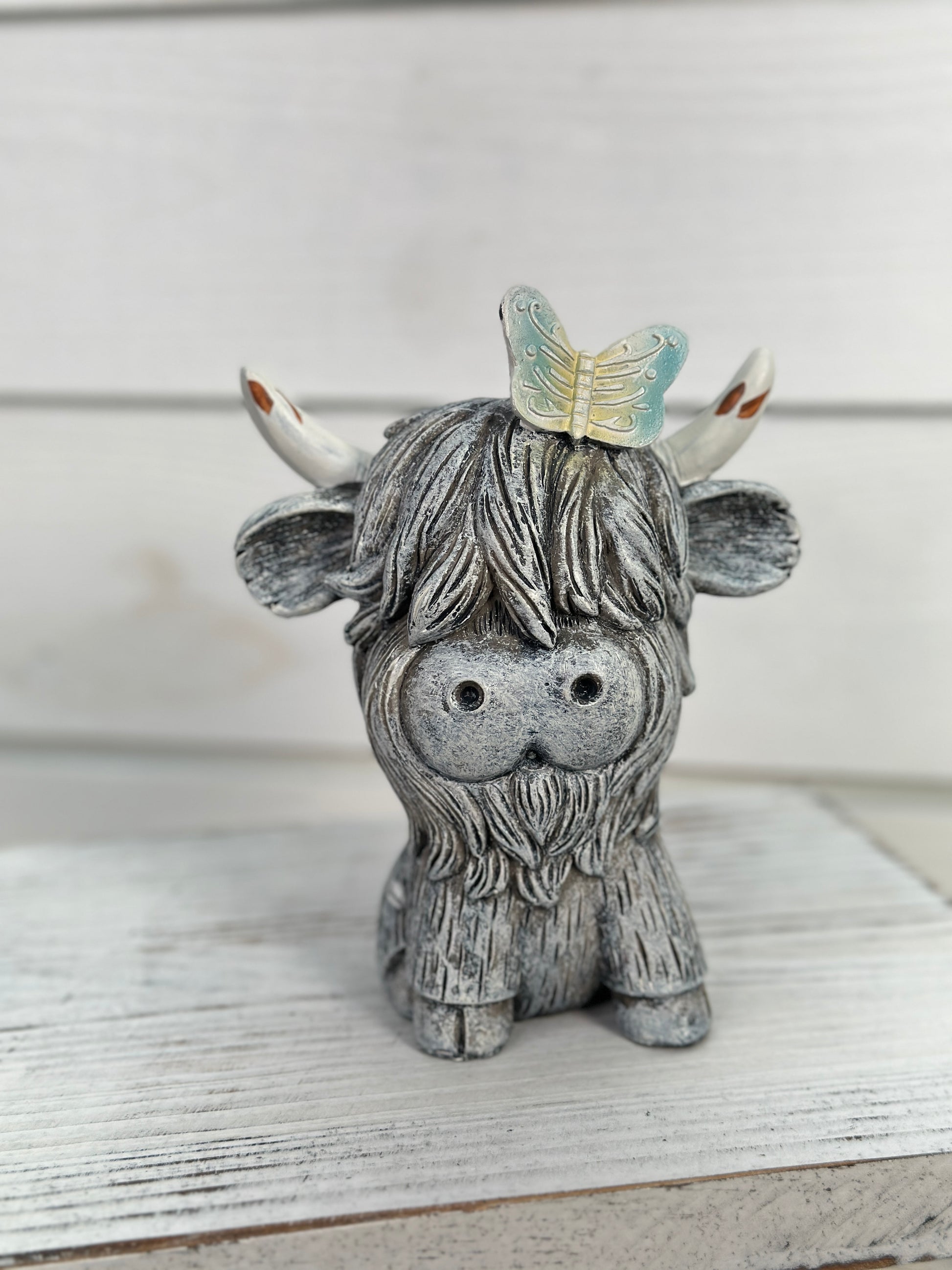 Sitting Cow Figurine With Butterfly On Head