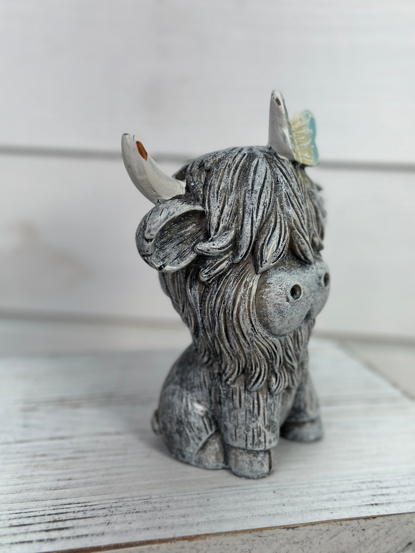 Sitting Cow Figurine With Butterfly On Head