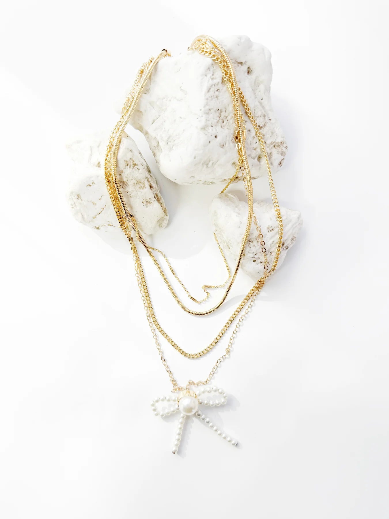 Southern Grace 4-Strand Necklace with Bow Pendant